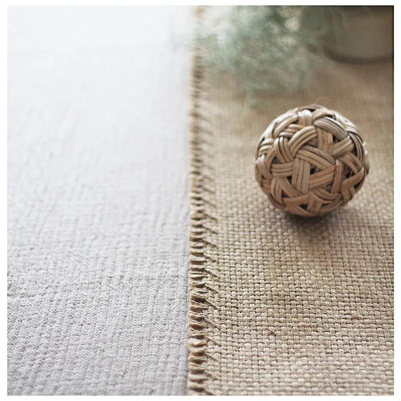 Yellow jute area rug with handmade fringed edges and non-skid backing, available in multiple sizes.