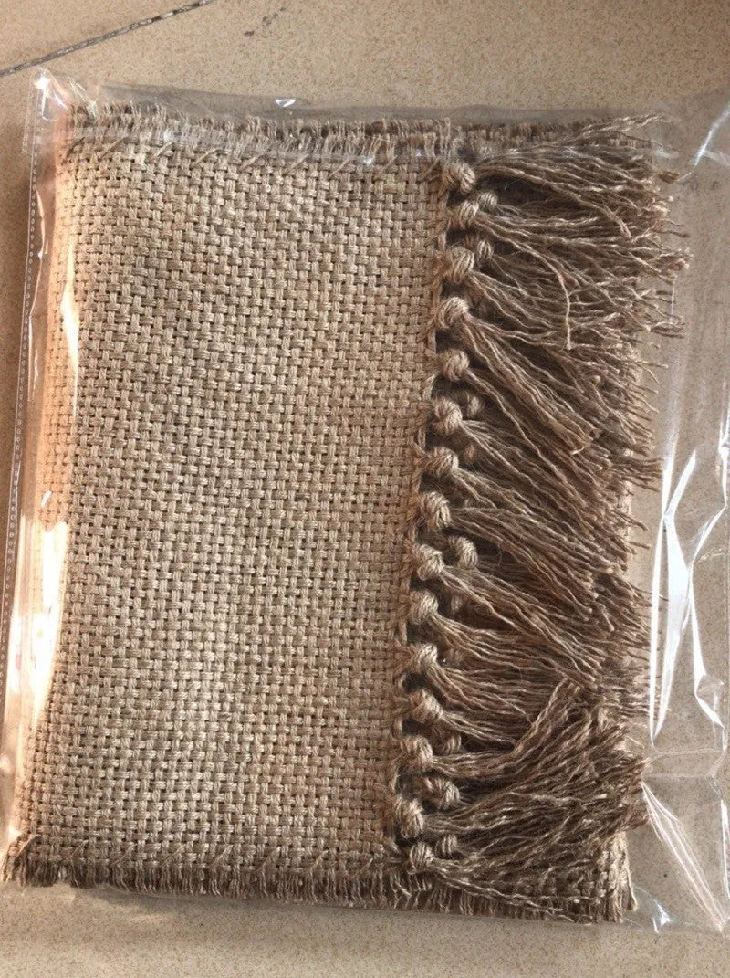 Yellow jute area rug with handmade fringed edges and non-skid backing, available in multiple sizes.