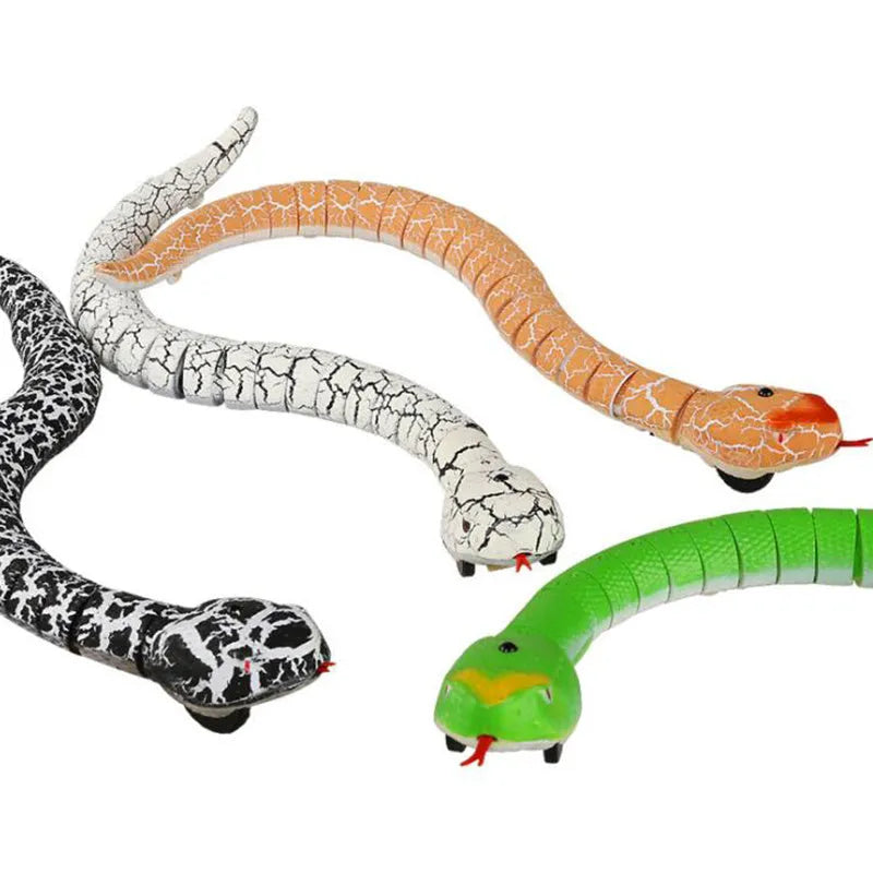 Black and grey remote control cobra snake toy on floor with USB charging cable and remote.