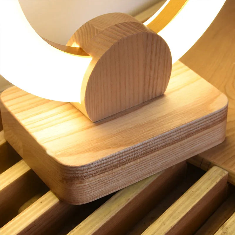 Nordic style wooden circular chandelier with a white Acrylic shade in two size options.
