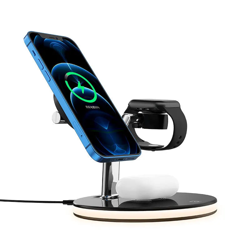 Black 15W 3-in-1 magnetic wireless charging station for iPhone, AirPods and Apple Watch on a desk.