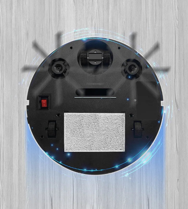 Golden coloured robotic vacuum cleaner with remote control on a hardwood floor.