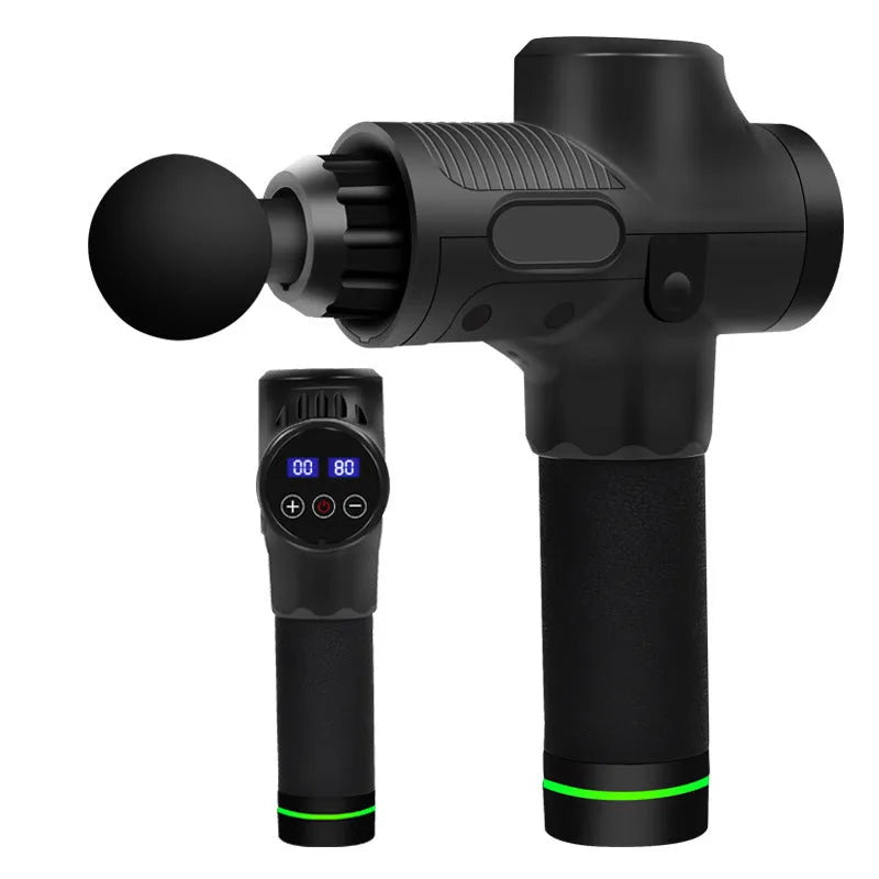 Black electric muscle massage gun with multiple interchangeable heads on a table.