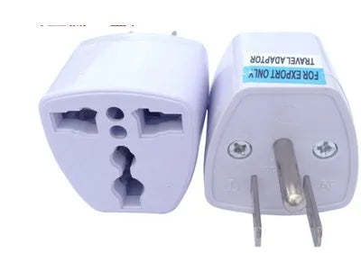 White universal travel adapter showing compatibility with AU, EU, UK, and US plug types.
