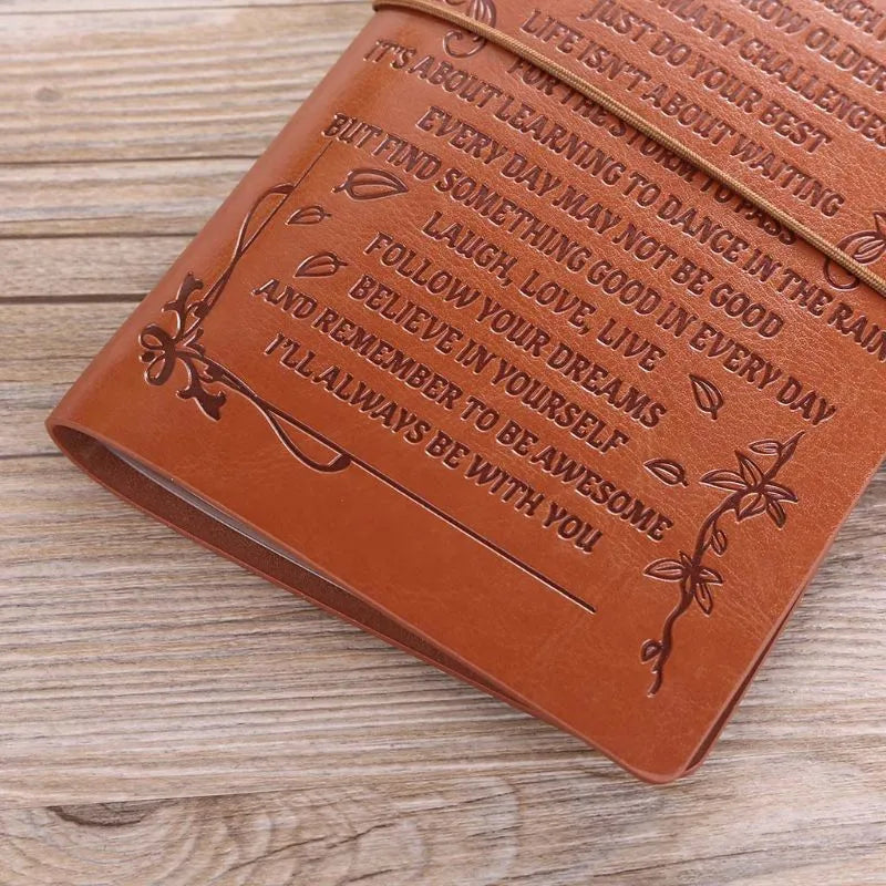 Brown leather hand ledger notebook with strap binding and acid-free paper pages
