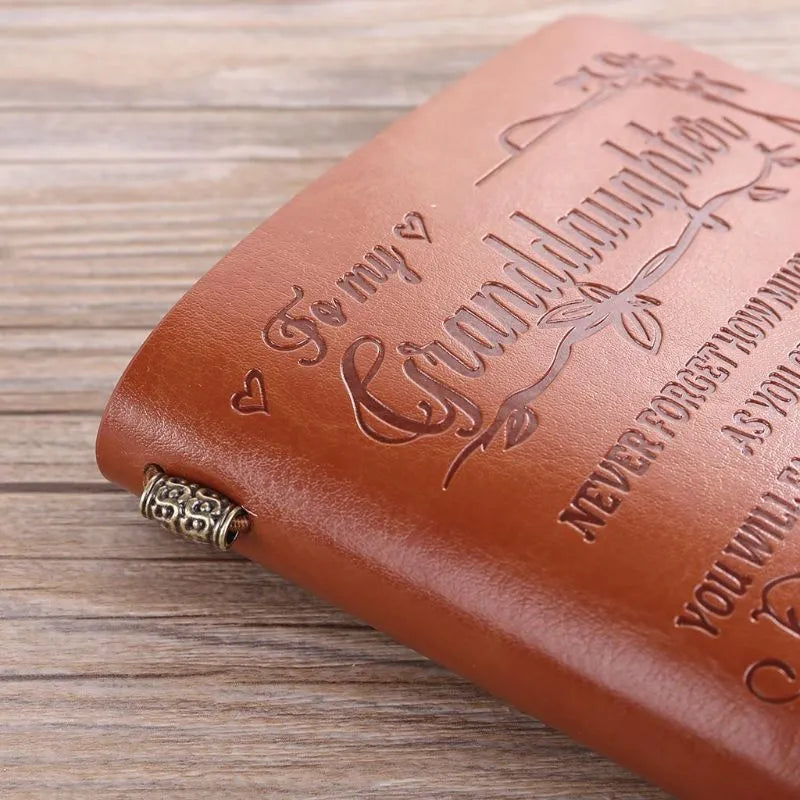 Brown leather hand ledger notebook with strap binding and acid-free paper pages