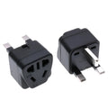Square white international power adapter converting to five UK three-pin sockets.