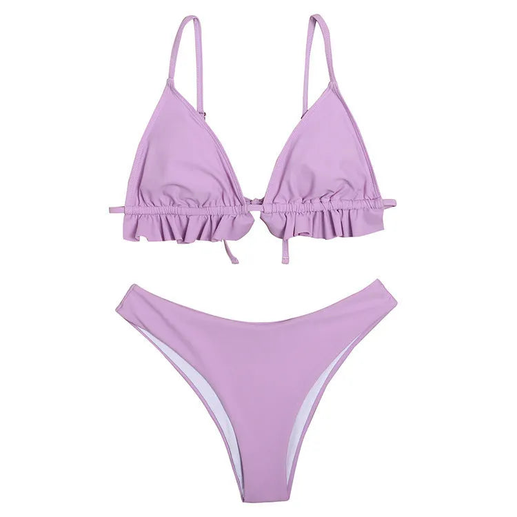 Ladies solid colour ruffled split backless swimsuit in lotus root on model