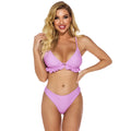 Ladies solid colour ruffled split backless swimsuit in lotus root on model