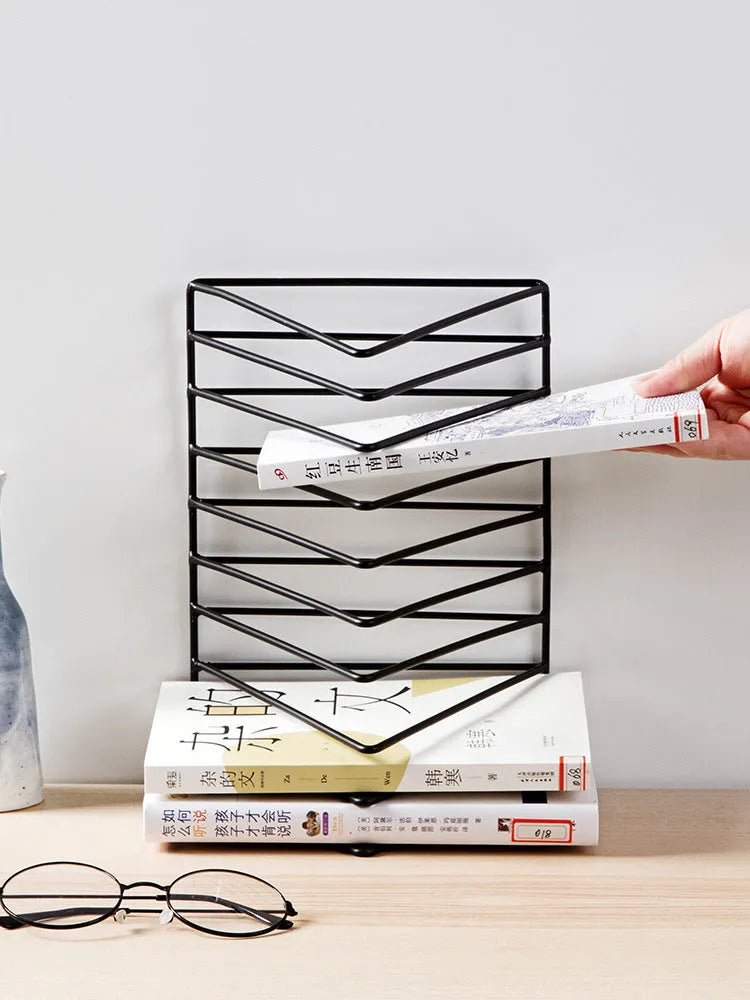 Wrought iron triangle desktop book stand in black or white, holding books upright on a desk