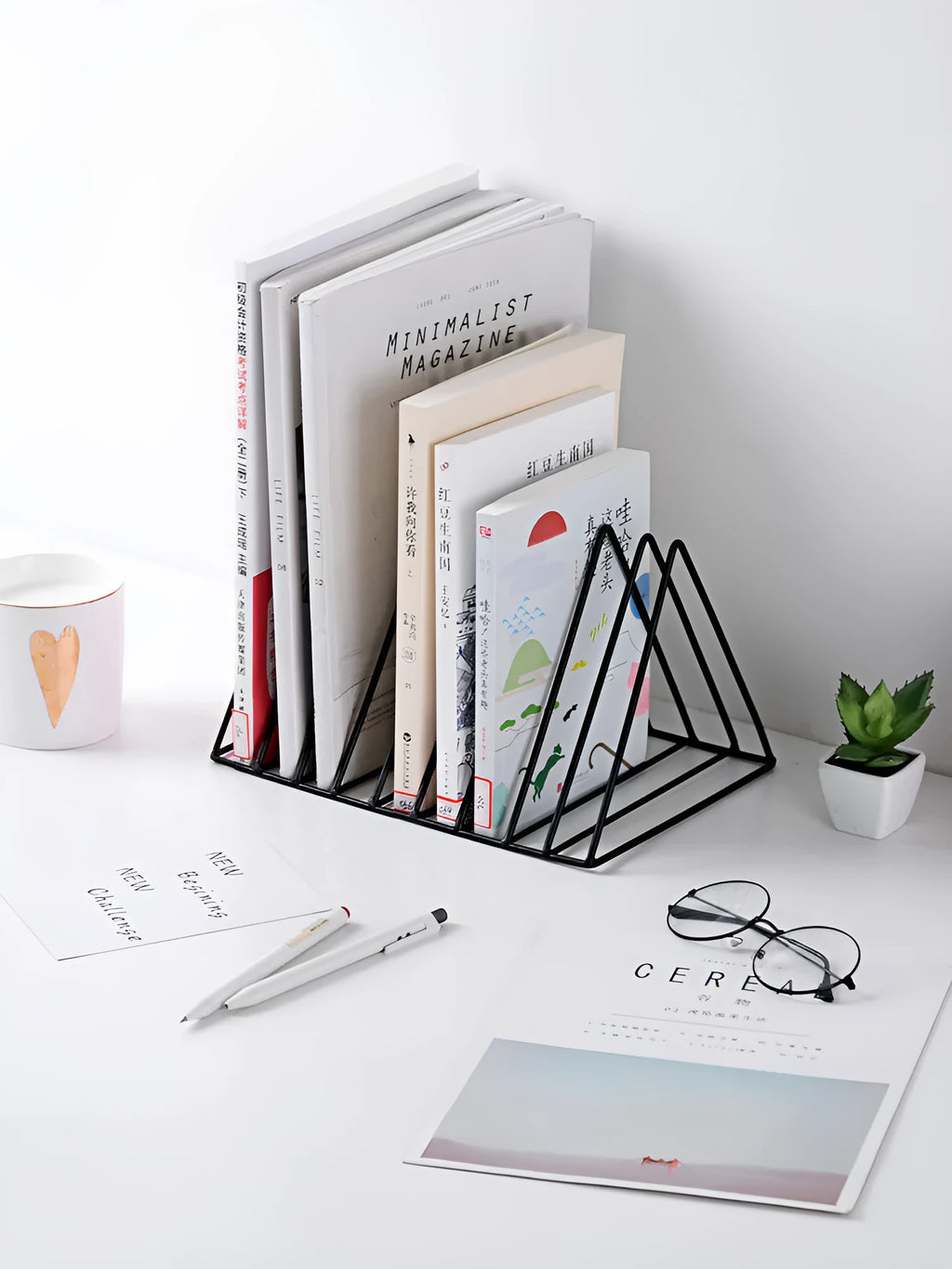 Wrought iron triangle desktop book stand in black or white, holding books upright on a desk