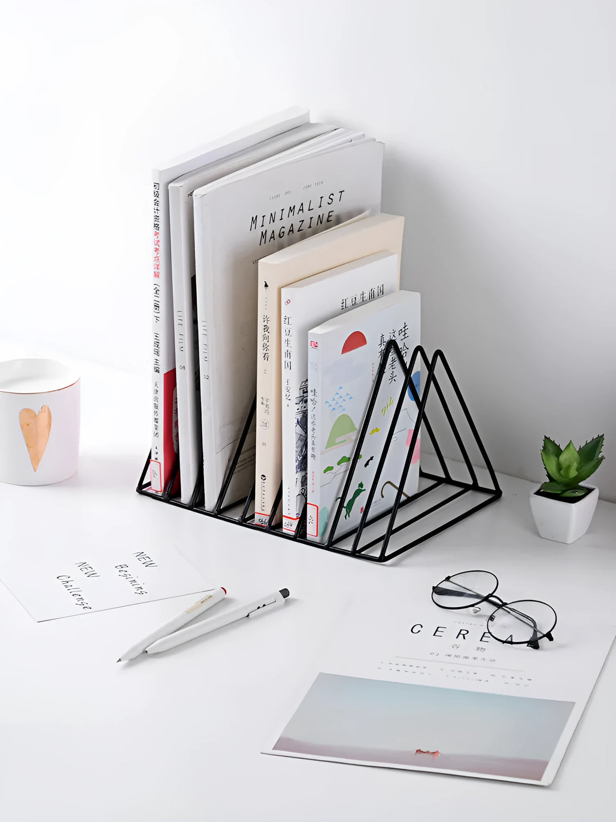 Wrought iron triangle desktop book stand in black or white, holding books upright on a desk