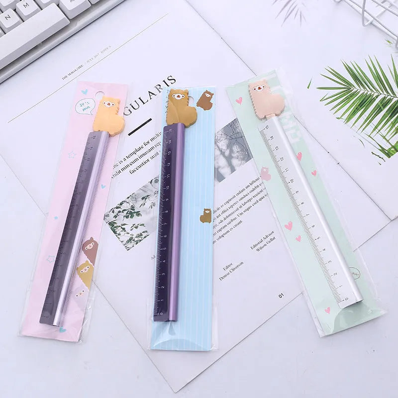 30cm aluminium ruler with centimetre and inch scales on a clear non-slip plastic backing.