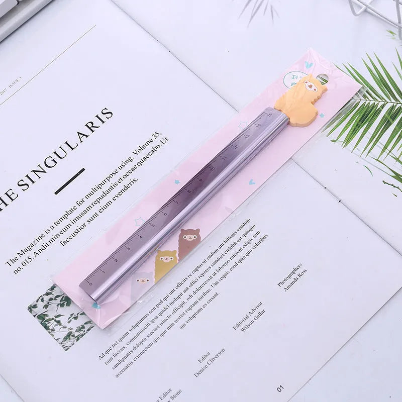 30cm aluminium ruler with centimetre and inch scales on a clear non-slip plastic backing.
