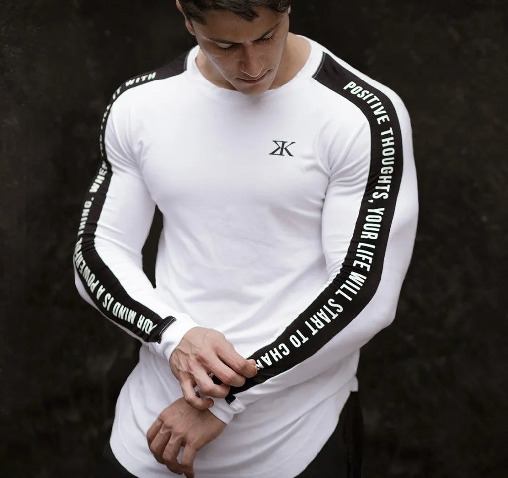 Men's long-sleeved compression base layer top, breathable elastic quick-drying wicking fitness training shirt, black or white, sizes M to 2XL.