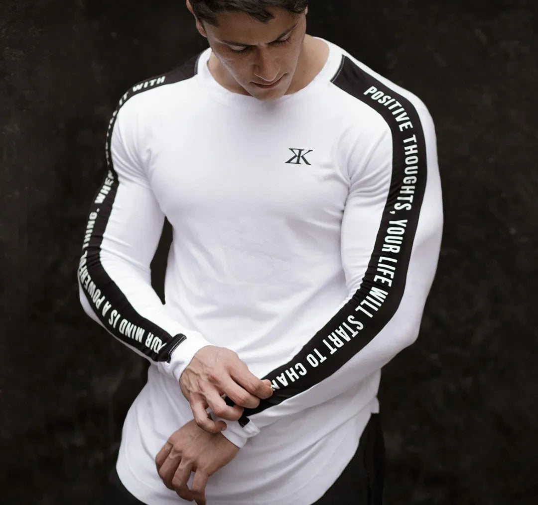 Men's long-sleeved compression base layer top, breathable elastic quick-drying wicking fitness training shirt, black or white, sizes M to 2XL.