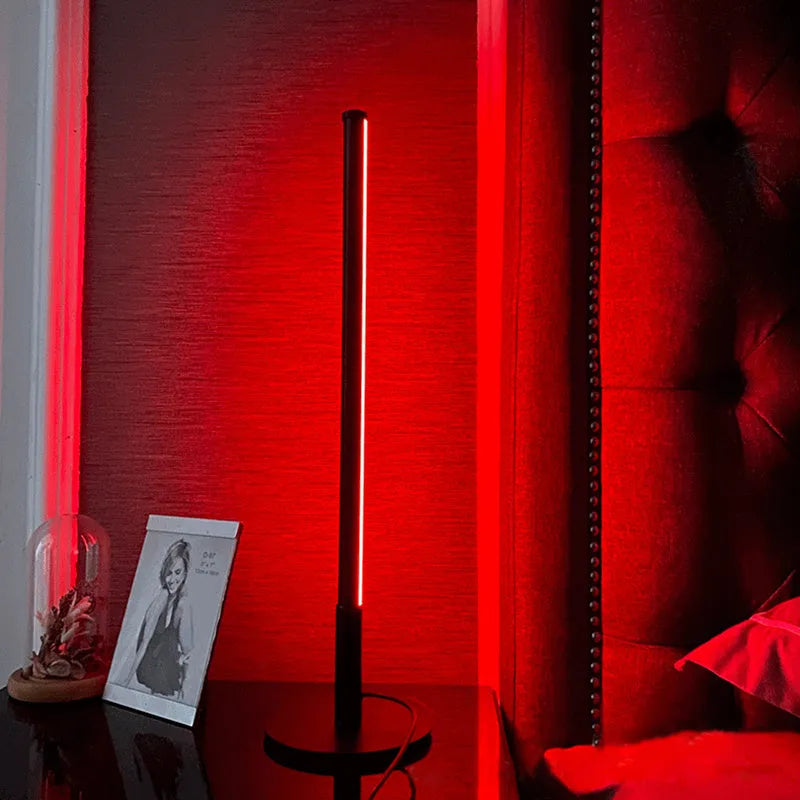 Nordic minimalism black bedside lamp with LED lighting and remote control on table