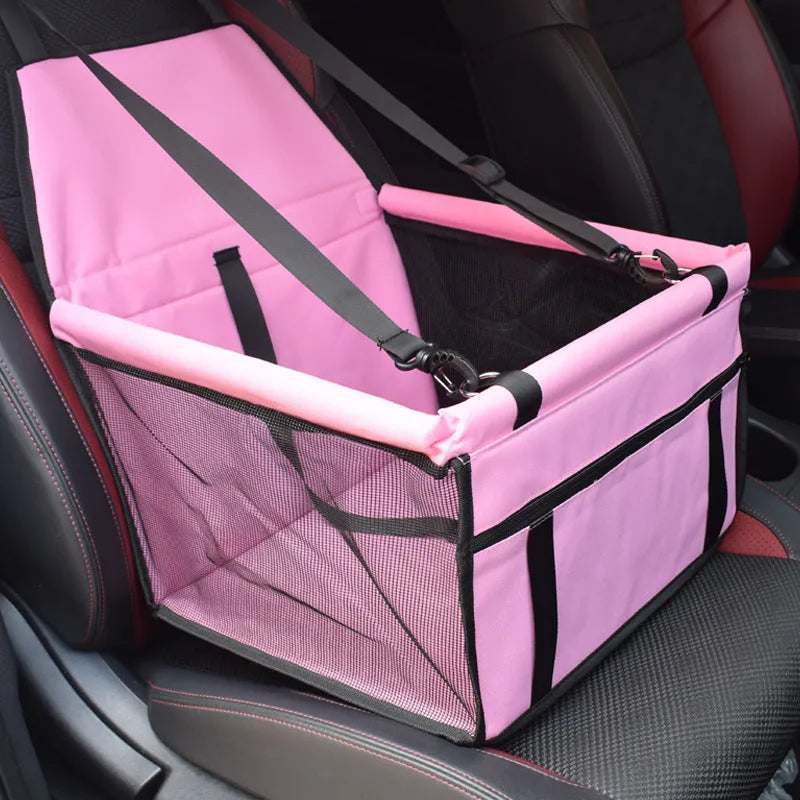 Red cloth pet car carrier bag with geometric pattern and safety tether for dog travel