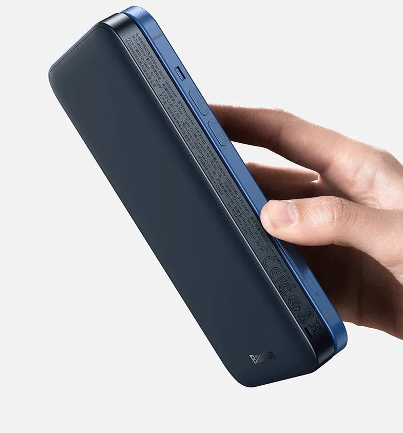 Black magnetic wireless power bank clipped onto an iPhone 12 showing 10000mAh capacity and two-way fast charging support