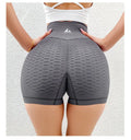 High-waisted jacquard peach hip yoga three-quarter shorts in Black, with quick-drying Lycra lining, size S/M.
