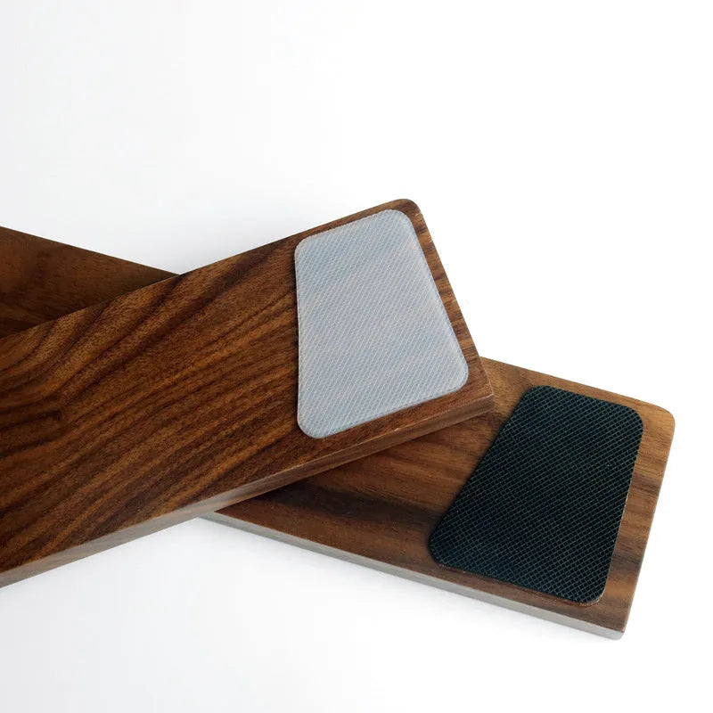Walnut wood mechanical keyboard wrist rest showing natural wood grain and ergonomic shape