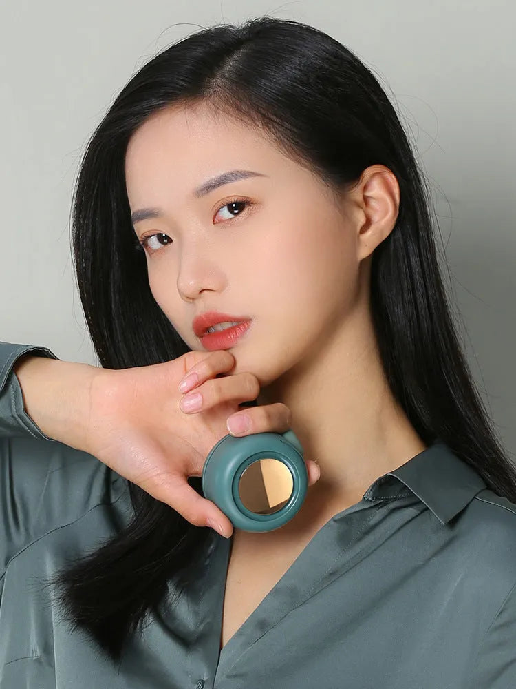 Mini clip fan in green with 900mAh battery, USB Type-C charging, and leafless design