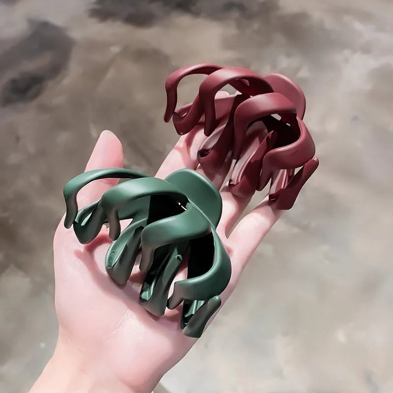 Children's hair clips in small and large sizes, shown in six colours including green, dark blue, wine red, black, dark pink, and blue grey.