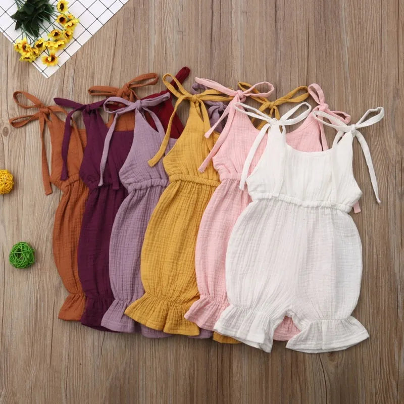 Sleeveless solid cotton romper jumpsuit for baby girls, available in multiple colours and sizes 70 to 110