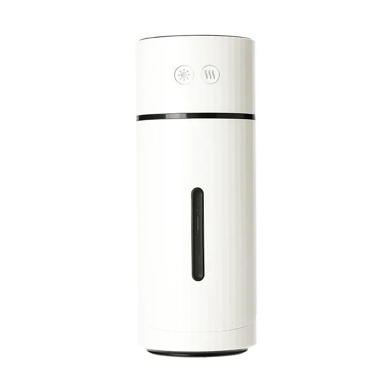 USB desktop humidifier with adjustable angle nozzle, white, with night light on, on a desk