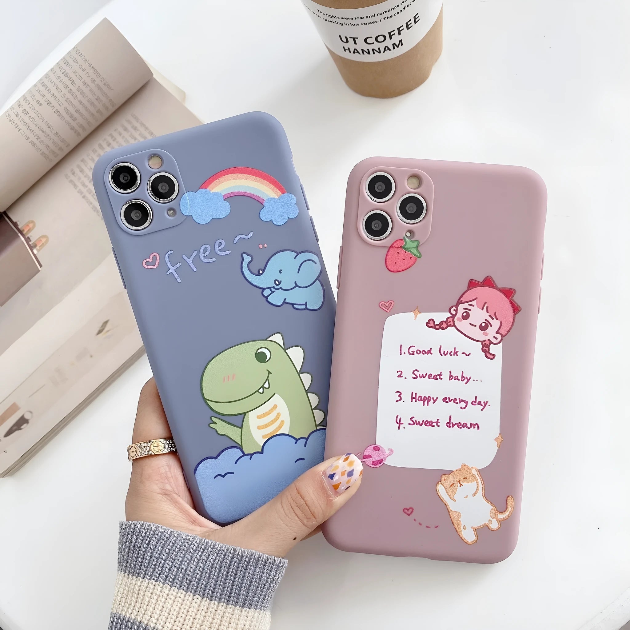 Blue frosted TPU iPhone case with a cartoon dinosaur print on the back.
