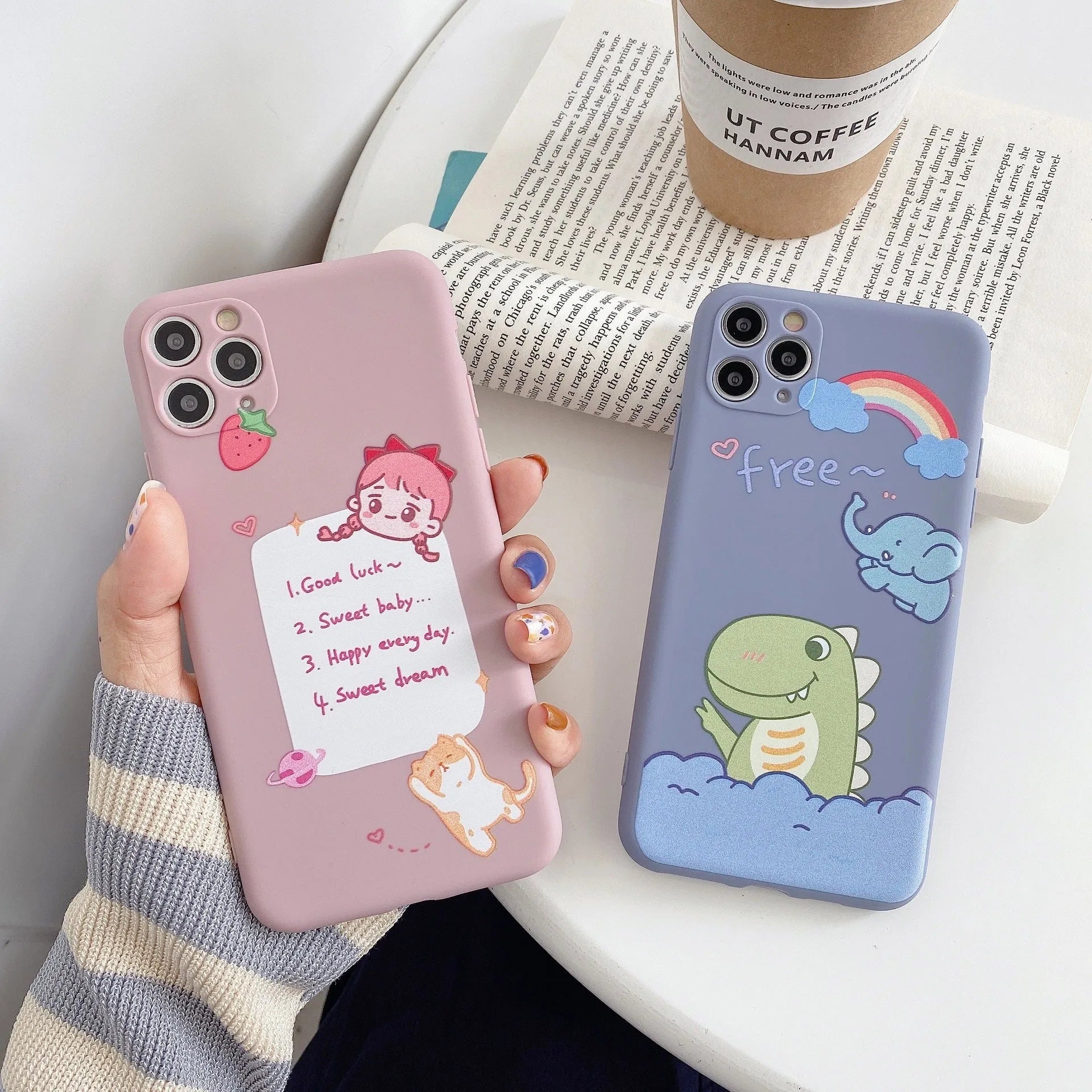 Blue frosted TPU iPhone case with a cartoon dinosaur print on the back.