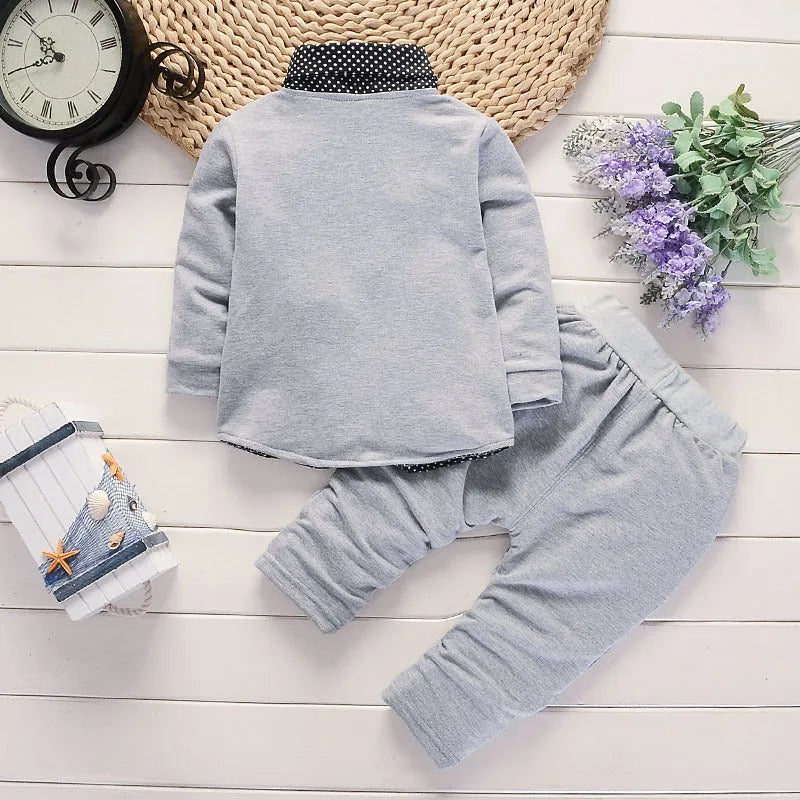 Toddler boy in a casual printed suit set, available in grey, navy blue, or red.
