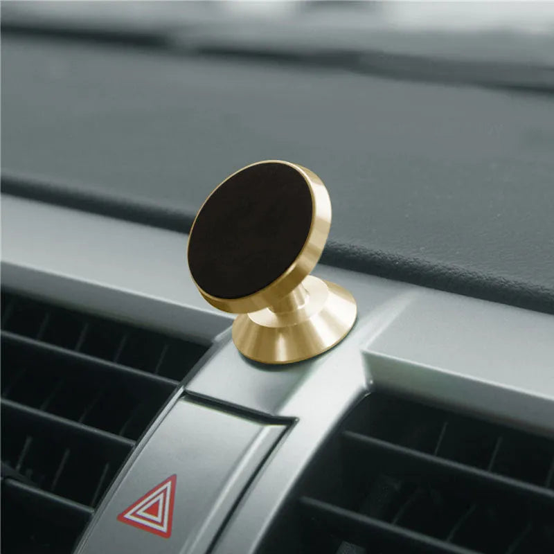 A universal magnetic car phone holder in black, silver, or gold, measuring 35.5mm by 40mm.