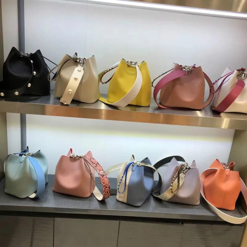 Leopard print PU bucket bag for women with rivet detail, python pattern strap, and magnetic buckle