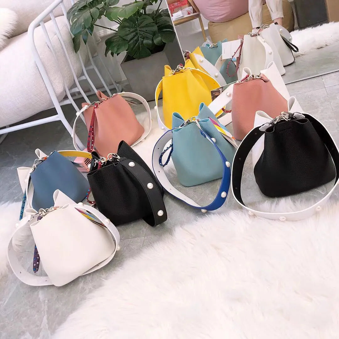 Leopard print PU bucket bag for women with rivet detail, python pattern strap, and magnetic buckle