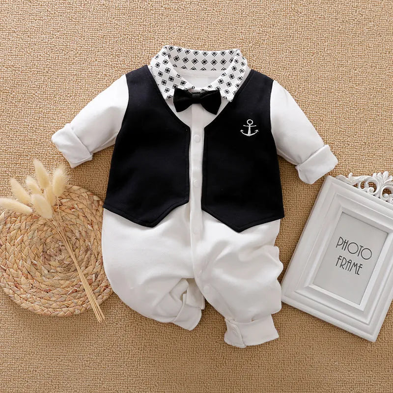 Baby boy in a cotton long-sleeved jumpsuit, navy blue gentleman style, for spring or autumn.