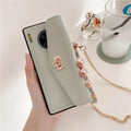 Imitation leather Huawei phone case with handbag pattern and gold chain, shown in pink, black, green, and grey colour options.