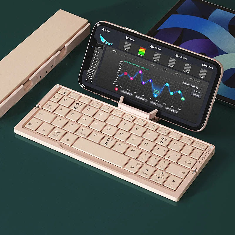 Aluminium folding Bluetooth keyboard open with phone on stand next to folded compact size