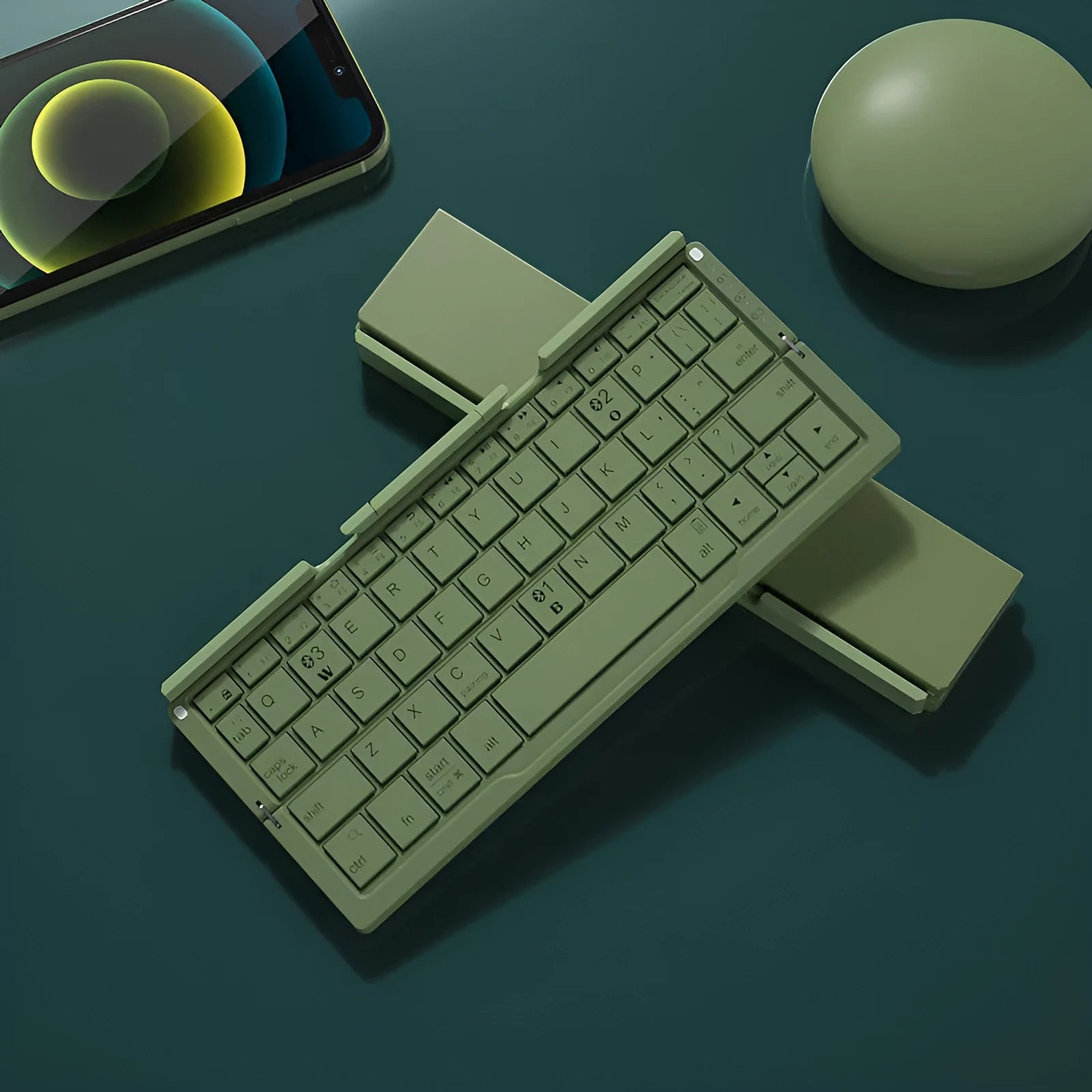Aluminium folding Bluetooth keyboard open with phone on stand next to folded compact size