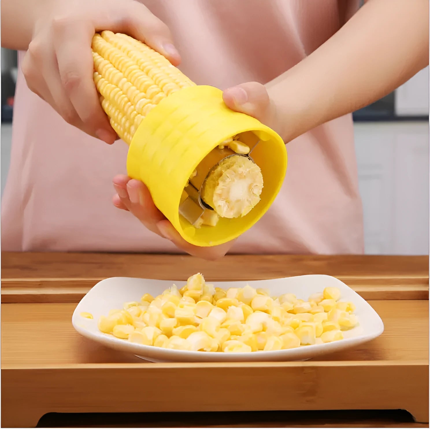 Yellow manual corn grinder thresher with corn-shaped PP grip and stainless steel gear.