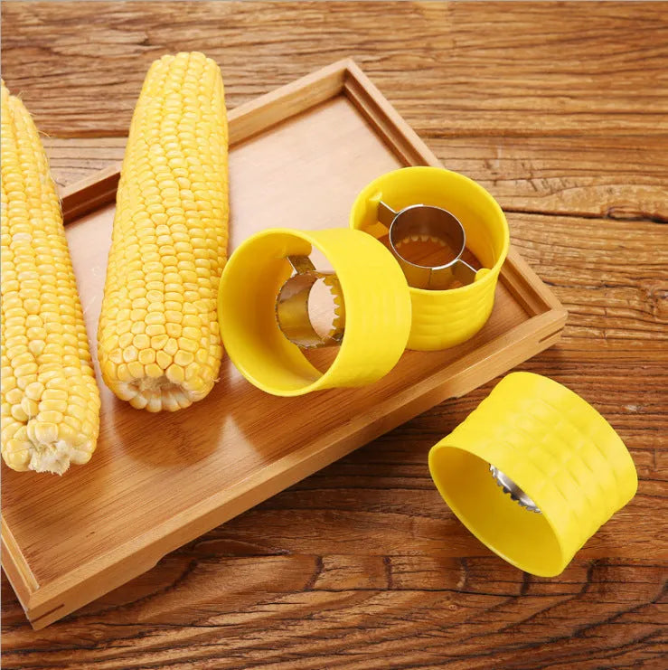 Yellow manual corn grinder thresher with corn-shaped PP grip and stainless steel gear.