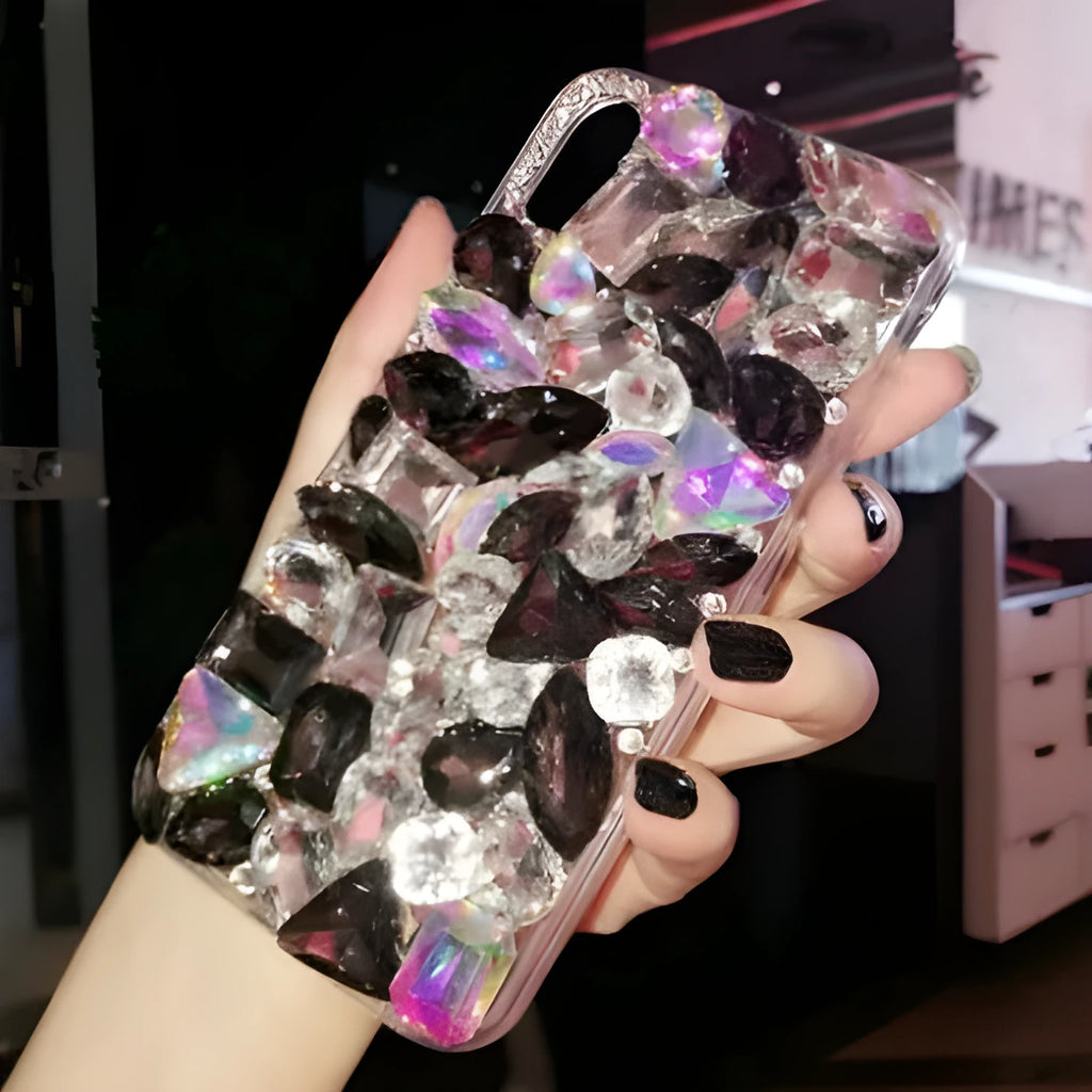 Clear rhinestone phone case for iPhone on a table showing crystal gem decoration
