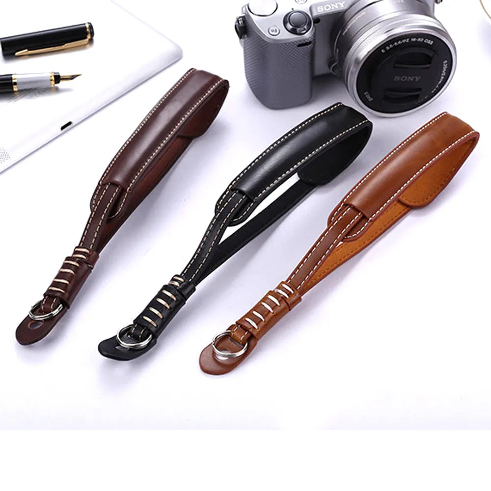 Black and brown universal camera wrist strap for DSLR and mirrorless cameras.