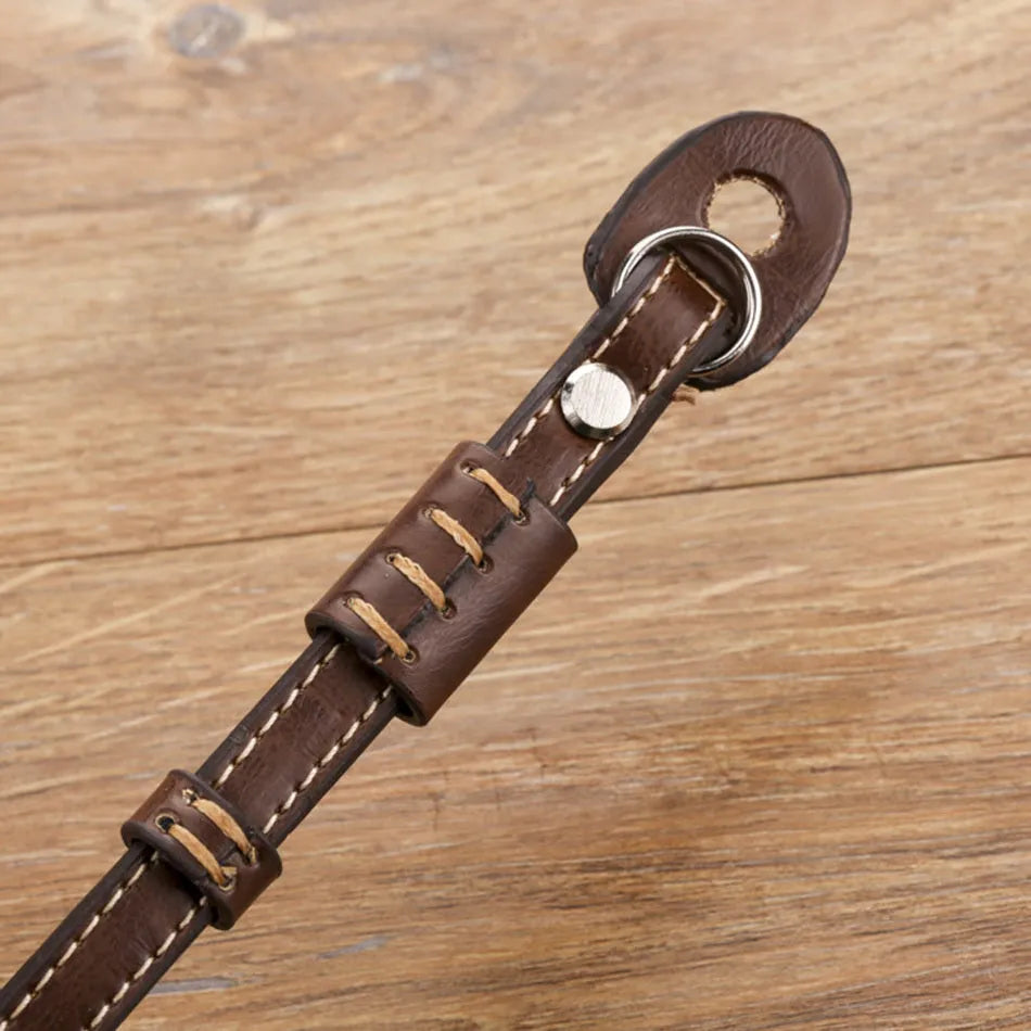 Black and brown universal camera wrist strap for DSLR and mirrorless cameras.