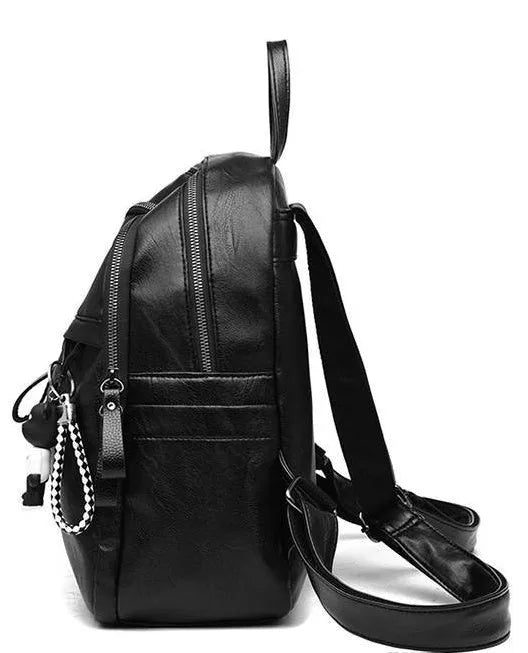 Black soft surface PU leather medium backpack with double straps and a detachable pendant
