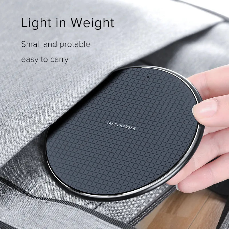 Round aluminium alloy wireless charger with black finish and Qi receiver for mobile phone charging