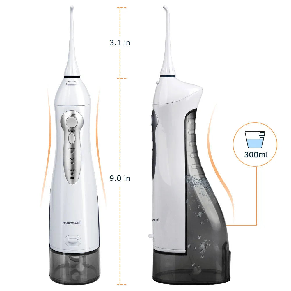 White portable oral irrigator water flosser with 330ml tank, 4 nozzles, and USB charging cable on a bathroom counter.