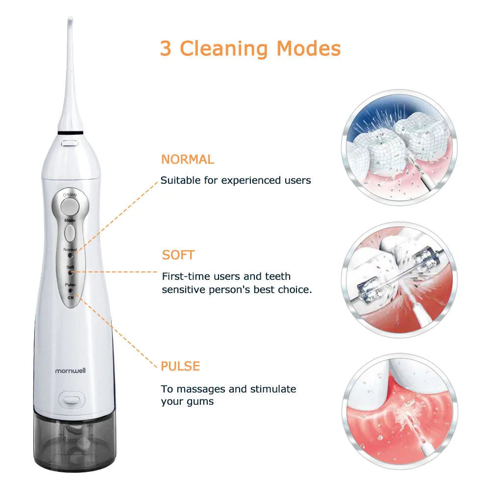White portable oral irrigator water flosser with 330ml tank, 4 nozzles, and USB charging cable on a bathroom counter.