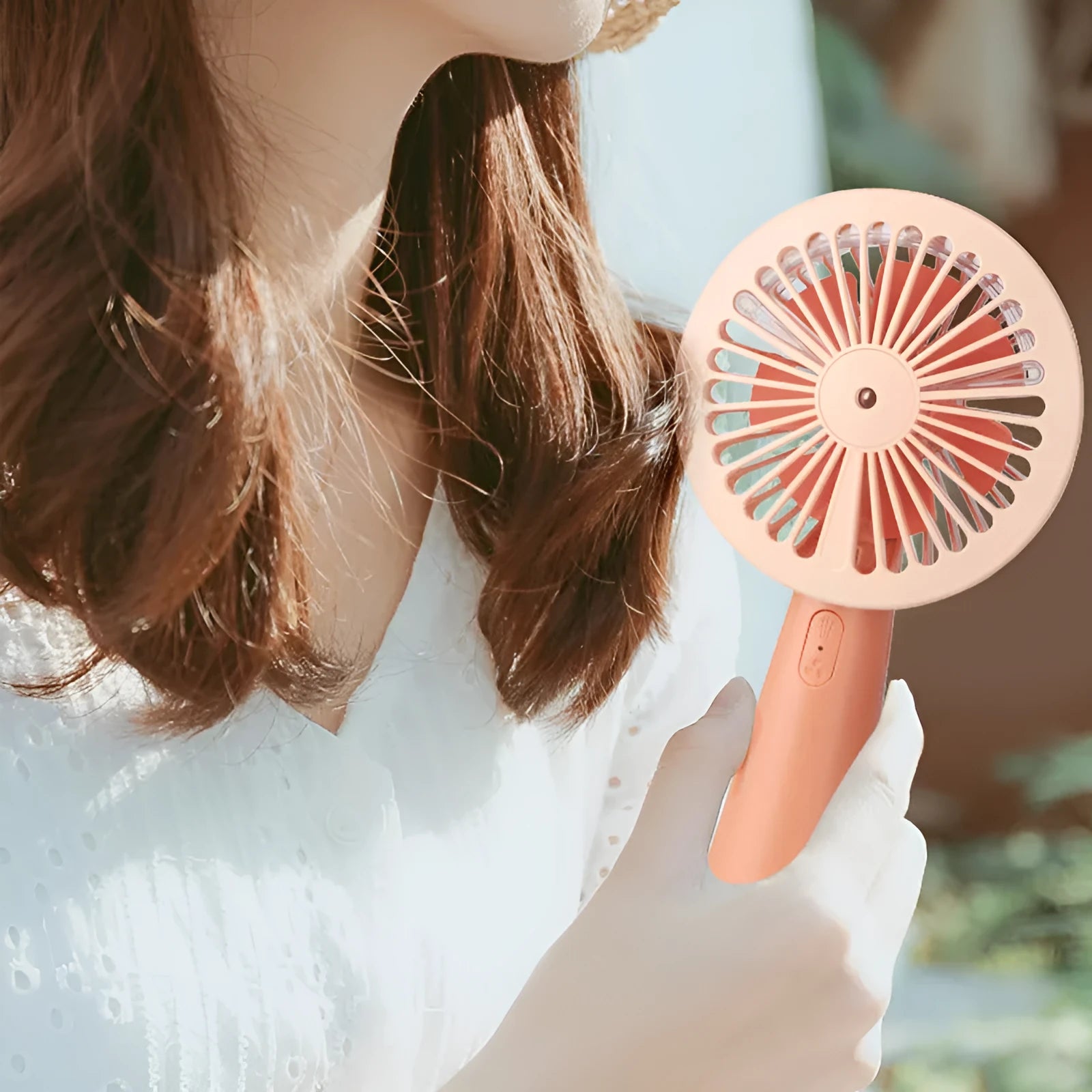 Nano spray fan handheld USB mini portable mist fan in green with plastic body and spray nozzle