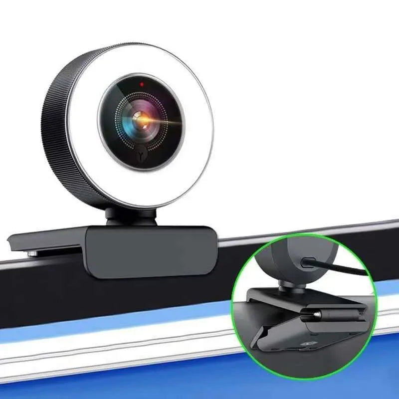 Black USB computer webcam with built-in fill light and microphone for 1080p HD video calls.
